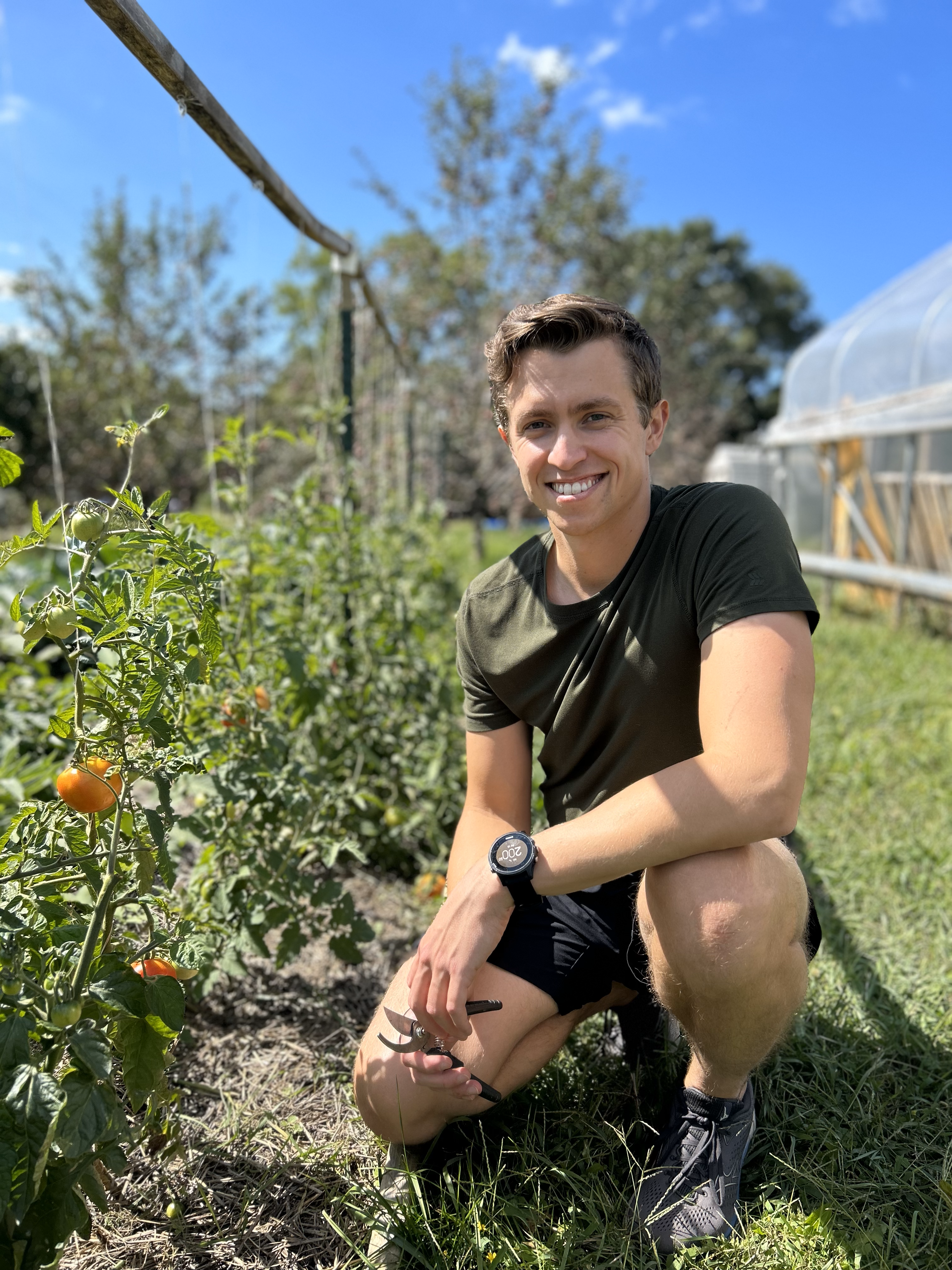 Ryan, founder of Urban Permascapes, working in an urban garden